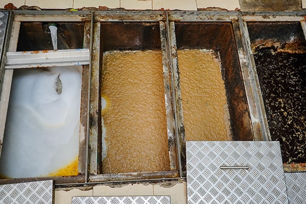 grease traps can become clogged with solidified grease and food particles, requiring regular grease trap maintenance